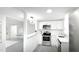 Bright kitchen with stainless steel appliances and modern white cabinetry at 800 Pritchard Avenue Ext # H3, Chapel Hill, NC 27516