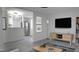 Open concept living room with a modern TV and sleek furniture at 800 Pritchard Avenue Ext # H3, Chapel Hill, NC 27516