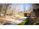 A quaint tunnel with colorful art highlights a path through the serene surrounding nature at 800 Pritchard Avenue Ext # H3, Chapel Hill, NC 27516