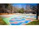 Outdoor basketball court with colorful art, providing a space for sports and creative expression at 800 Pritchard Avenue Ext # H4, Chapel Hill, NC 27516