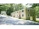 Two-story apartment building with tidy landscaping and covered entryways at 800 Pritchard Avenue Ext # H4, Chapel Hill, NC 27516