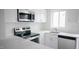 Bright kitchen featuring stainless steel appliances, modern cabinets, and a quartz countertop at 800 Pritchard Avenue Ext # H4, Chapel Hill, NC 27516