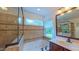 Bathroom features a soaking tub with jets, a tile surround, and natural light from the window at 8042 Hogan Dr, Wake Forest, NC 27587