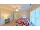 Well-lit bedroom showcasing a bed, ceiling fan, and a calming atmosphere at 8042 Hogan Dr, Wake Forest, NC 27587