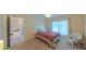 Cozy bedroom with a comfortable bed, ample natural light, and access to the upper floor at 8042 Hogan Dr, Wake Forest, NC 27587