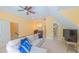 Spacious bonus room with a comfortable seating area and a kitchenette at 8042 Hogan Dr, Wake Forest, NC 27587