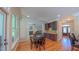 Bright and inviting dining room with hardwood floors and a view of the living room at 8042 Hogan Dr, Wake Forest, NC 27587