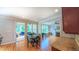 Inviting dining area with hardwood floors and view of a sun room and living room at 8042 Hogan Dr, Wake Forest, NC 27587