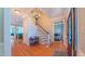 Elegant foyer with hardwood floors, staircase, and decorative chandelier creating a grand entrance at 8042 Hogan Dr, Wake Forest, NC 27587