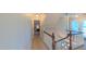 Hallway with stairs, doorway, and closet, offering seamless transition within the home at 8042 Hogan Dr, Wake Forest, NC 27587
