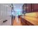 Spacious kitchen with stainless steel appliances, wooden cabinets, granite countertops and hardwood floors at 8042 Hogan Dr, Wake Forest, NC 27587