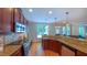 Spacious kitchen features wooden cabinets, granite countertops, and stainless steel appliances at 8042 Hogan Dr, Wake Forest, NC 27587