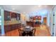 Open floor plan with a kitchen island, dining area, and hardwood floors at 8042 Hogan Dr, Wake Forest, NC 27587