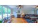Comfortable living room with hardwood floors, fireplace, and large windows with lots of natural light at 8042 Hogan Dr, Wake Forest, NC 27587