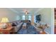 Beautiful living room featuring a comfortable sofa, chair, fireplace and large-screen TV at 8042 Hogan Dr, Wake Forest, NC 27587