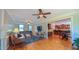 Bright living room area with hardwood floors and direct views of the kitchen and eat-in breakfast area at 8042 Hogan Dr, Wake Forest, NC 27587