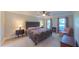 Spacious main bedroom featuring a ceiling fan, plush carpet, and ensuite bathroom access at 8042 Hogan Dr, Wake Forest, NC 27587
