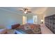 Well-lit main bedroom featuring a ceiling fan, ensuite bathroom access, and carpet at 8042 Hogan Dr, Wake Forest, NC 27587