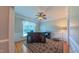 Bright home office with large window, wainscotting, and classic decor perfect for remote work at 8042 Hogan Dr, Wake Forest, NC 27587