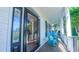 Inviting front porch featuring classic rocking chairs, offering a relaxing outdoor living space at 8042 Hogan Dr, Wake Forest, NC 27587