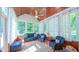 Bright sunroom with a ceiling fan, wood ceiling, and lots of windows at 8042 Hogan Dr, Wake Forest, NC 27587