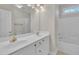 Bright bathroom with double sink vanity, white cabinets, and tub-shower combo at 805 Alden Bridge Dr, Cary, NC 27519