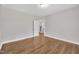 Hardwood flooring, neutral paint, and a view of a staircase from this bedroom at 805 Alden Bridge Dr, Cary, NC 27519