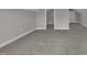 Carpeted bedroom with neutral walls and white trim with an adjacent door at 805 Alden Bridge Dr, Cary, NC 27519