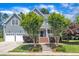 Charming two-story home featuring a manicured lawn, attached garage and classic architectural details at 805 Alden Bridge Dr, Cary, NC 27519