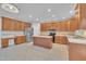 Expansive kitchen with wooden cabinets, stainless steel appliances, central island and stylish tile floor at 805 Alden Bridge Dr, Cary, NC 27519