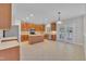 Open kitchen with an island, wooden cabinets, stainless steel appliances, and ample counter space at 805 Alden Bridge Dr, Cary, NC 27519