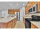 Well-equipped kitchen featuring wood cabinets, stainless appliances, and plenty of counter space at 805 Alden Bridge Dr, Cary, NC 27519