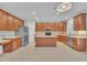 Bright kitchen with light countertops, stainless steel appliances, central island and a tile floor at 805 Alden Bridge Dr, Cary, NC 27519