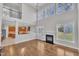 Open concept living room features hardwood floors, fireplace and lots of natural light at 805 Alden Bridge Dr, Cary, NC 27519