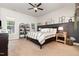 Cozy main bedroom with a ceiling fan, natural light, and stylish decor at 816 Trumpet Vine Ct, Wendell, NC 27591