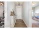Bright entryway with hardwood floors, a decorative cabinet, and a view into a playful room at 816 Trumpet Vine Ct, Wendell, NC 27591