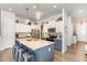 Beautiful kitchen with modern finishes, granite countertops, stainless steel appliances, and a large center island at 816 Trumpet Vine Ct, Wendell, NC 27591