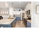 Modern kitchen featuring stainless steel appliances, and a center island with barstool seating, granite countertops at 816 Trumpet Vine Ct, Wendell, NC 27591