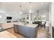 Gourmet kitchen island featuring granite countertops, stainless steel appliances, and pendant lighting at 816 Trumpet Vine Ct, Wendell, NC 27591