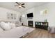 Bright living room with hardwood floors, a fireplace, and a comfortable sectional sofa at 816 Trumpet Vine Ct, Wendell, NC 27591