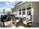 Outdoor dining set on a wooden deck, ideal for entertaining with backyard view at 816 Trumpet Vine Ct, Wendell, NC 27591