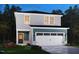 Charming two-story home with gray siding, white trim, a front-entry garage, and colorful landscaping at 840 Ottawa Dr, Garner, NC 27529