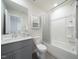 Bright bathroom featuring a shower and tub combo and modern vanity at 845 Ottawa Dr, Garner, NC 27529