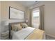 Cozy bedroom features a comfortable bed, soft lighting, and a window with natural light at 845 Ottawa Dr, Garner, NC 27529
