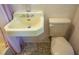 Vintage bathroom sink and toilet, showcasing the home's original design and color scheme at 903 W Maynard Ave, Durham, NC 27704
