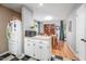 This dining area features a hardwood floor and a microwave on top of a cabinet at 903 W Maynard Ave, Durham, NC 27704