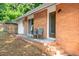 Exterior view of home and brick patio with seating at 903 W Maynard Ave, Durham, NC 27704