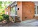 Exterior of home with brick, white railing and stairs at 903 W Maynard Ave, Durham, NC 27704