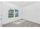 Well-lit bedroom with large windows providing outdoor views at 94 Mable Court # 16, Lillington, NC 27546
