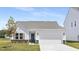 Charming single-Gathering home with a gray roof, well-manicured lawn, and a two-car garage at 94 Mable Court # 16, Lillington, NC 27546